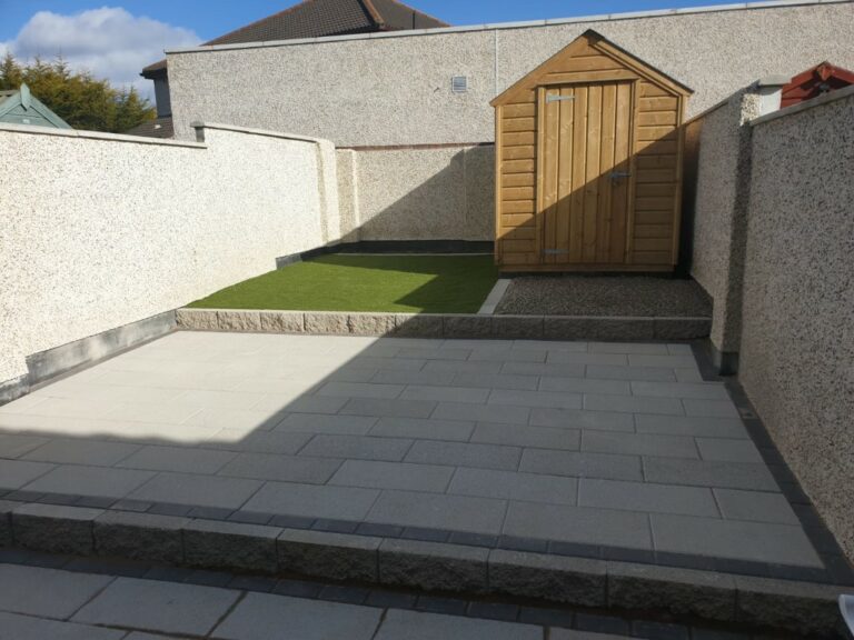 Tiered Granite Patio with Astroturf and Gravel Patch in Dublin